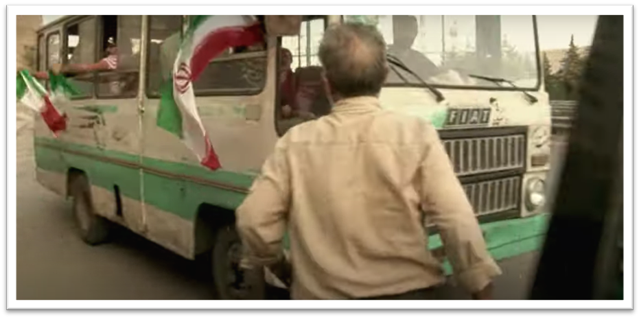 A pale green, dirty bus is depicted which is full of Pakistani footbal funs. 