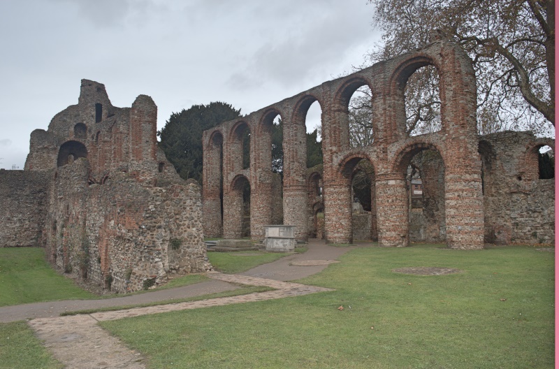 A stone building with arches